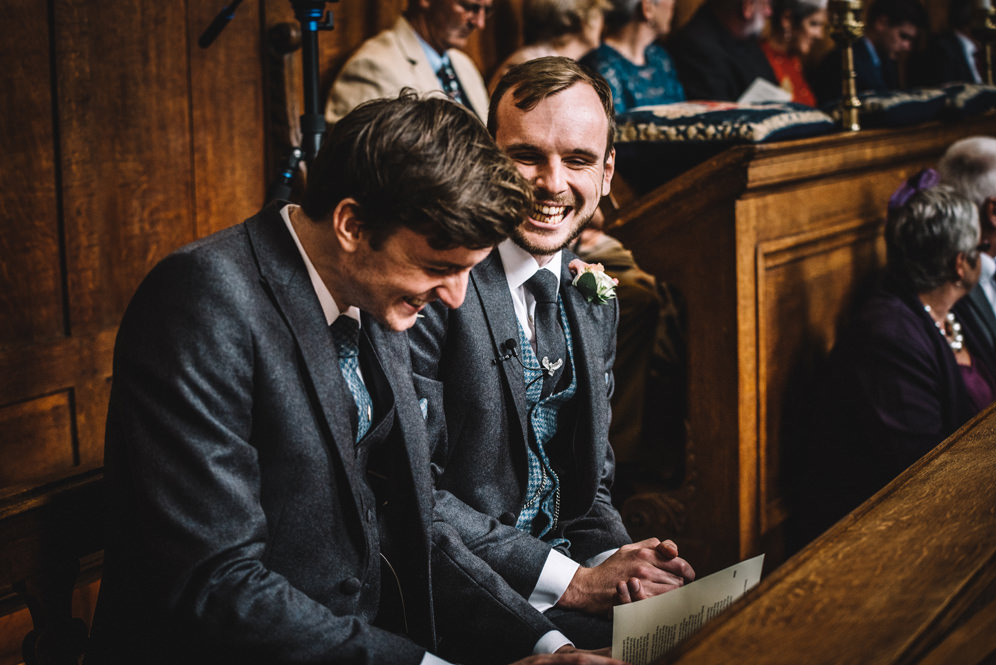 groom and best man laughing