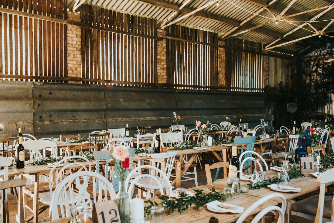 old barn transfored into boho wedding venue